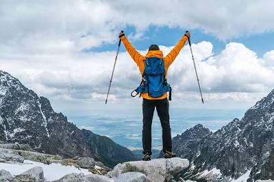 Picture of man on top of a mountain