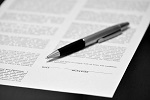 picture of a contract with pen