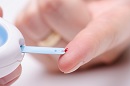 picture of diabetic checking blood sugar