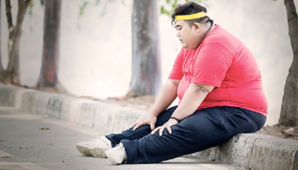 Obese man tired from exercising