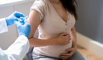 pregnant woman receiving vaccine
