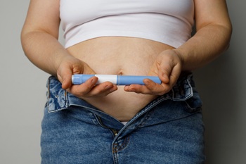 obese woman with weight-loss injection